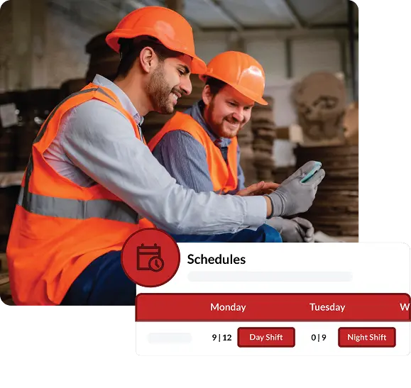 Two maintenance operators looking at their scheduling software